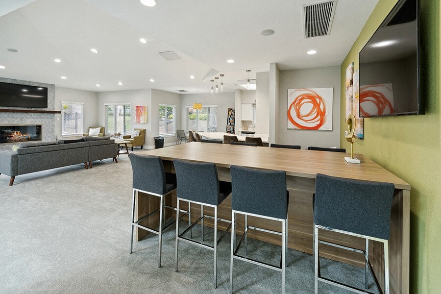 Community Clubhouse with Lounge Furniture and Fireplace at The Club Apartments located in Hillsboro, OR.