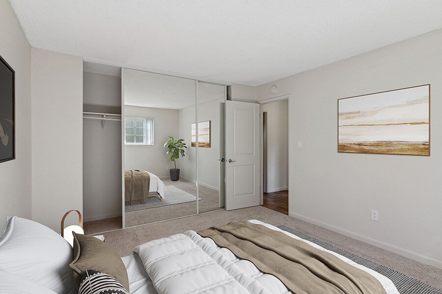 Model Bedroom with Carpet and Large Closet at Los Gatos Landing Apartments located in San Jose, CA.
