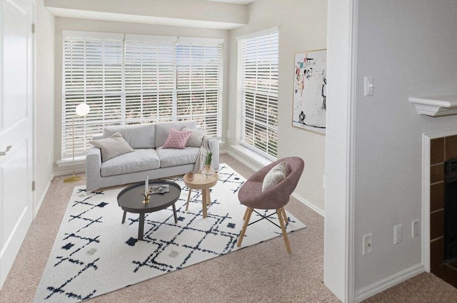 Model living room with large windows at Autumnwood, Arlington