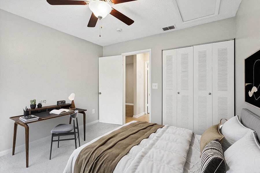 Model Bedroom with Carpet and Closet at Huntington Place Apartments located in Sarasota, FL.