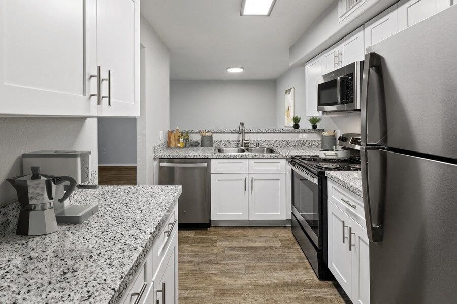 Model kitchen showcasing stainless steel appliances.