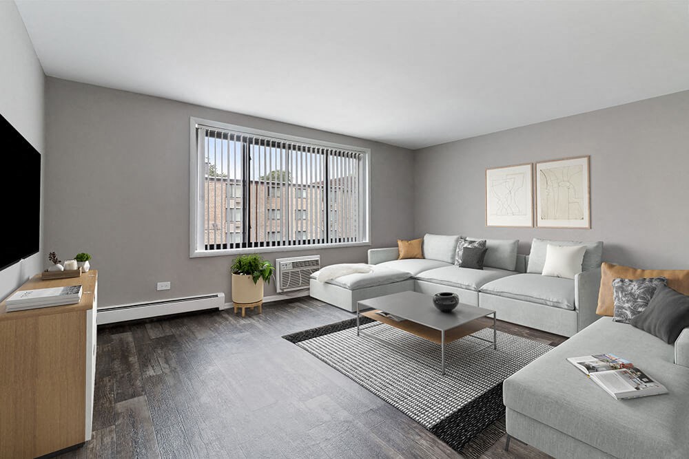 Model Living Room with Wood-Style Flooring at Midpointe Apartments in Chicago, IL.