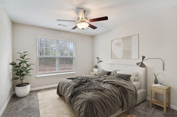 Model bedroom at Retreat at Stonecrest Apartments - Photo Gallery 8