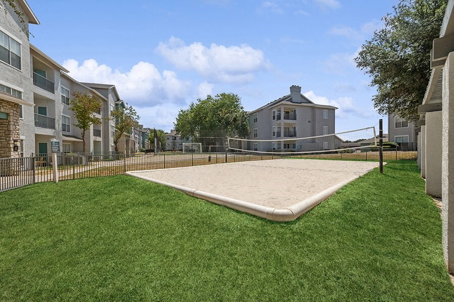 Community Sand Volleyball Court with Net at Essence Apartments in Dallas, TX.