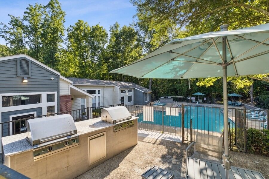 BBQ area poolside with cabana