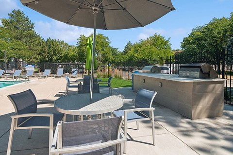 Outdoor BBQ Area with Furniture at Overlook Apartments located in Salt Lake City, UT.