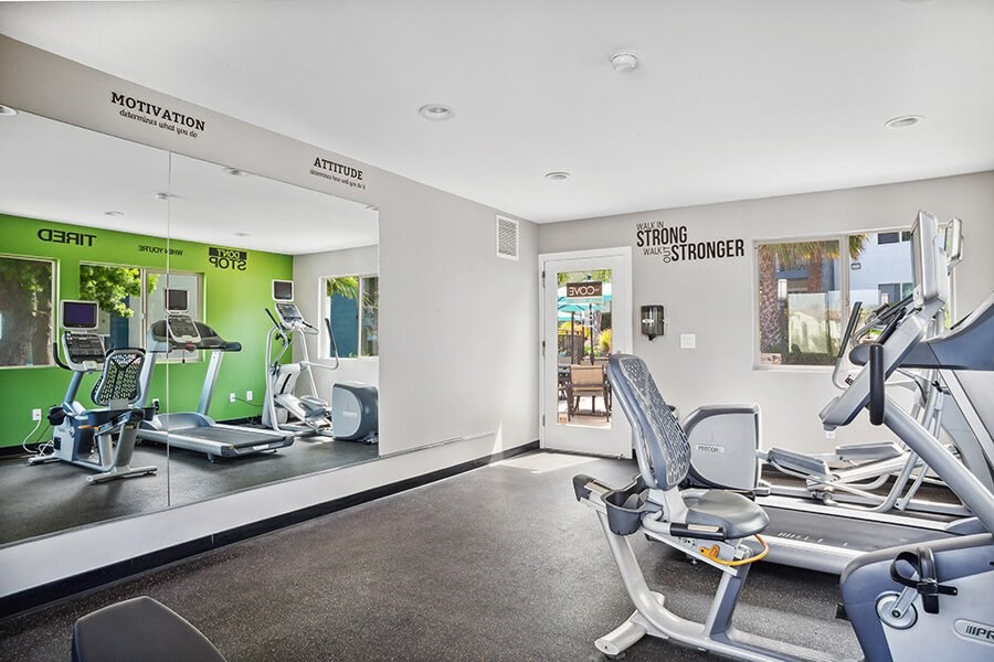 Community Fitness Center with Equipment at Cove La Mesa Apartments located in La Mesa, CA.