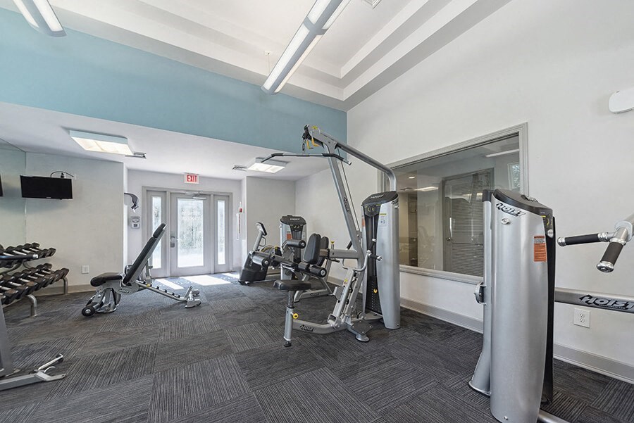 Community Fitness Center with Equipment at The Commons at Haynes Farm Apartments in Boston, MA.
