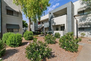 Apartment exterior and well kept landscape