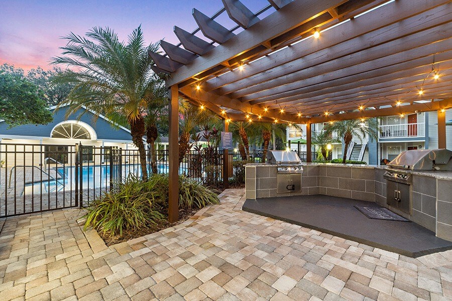 Outdoor BBQ Area with Canopy at Retreat at Crosstown Apartments in Riverview, FL.