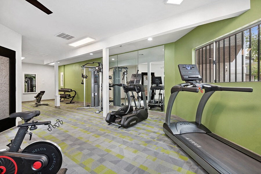 Community Fitness Center with Equipment at Crystal Creek Apartments in Phoenix, AZ.