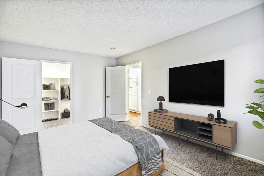 Model bedroom with walk-in closet