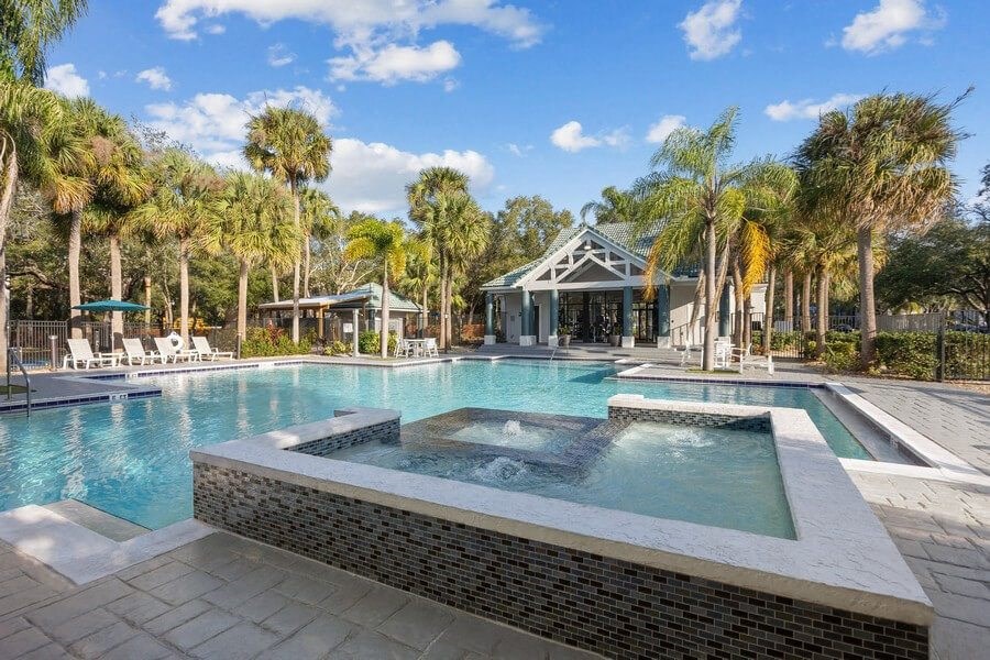 Community Hot Tub and Pool View at Caribbean Breeze Apartments in Tampa, FL.