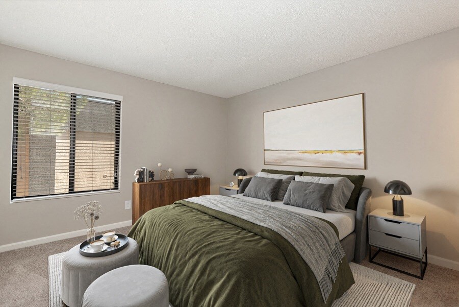 Model apartment bedroom with a bed at Saratoga Ridge, Arizona