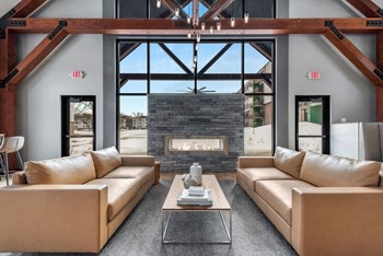 Resident lounge with sofas and fireplace - Photo Gallery 8