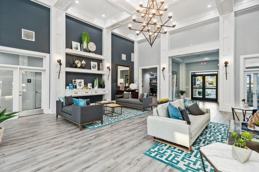 Community lounge with sofas at Park West Apartments in Houston, Texas