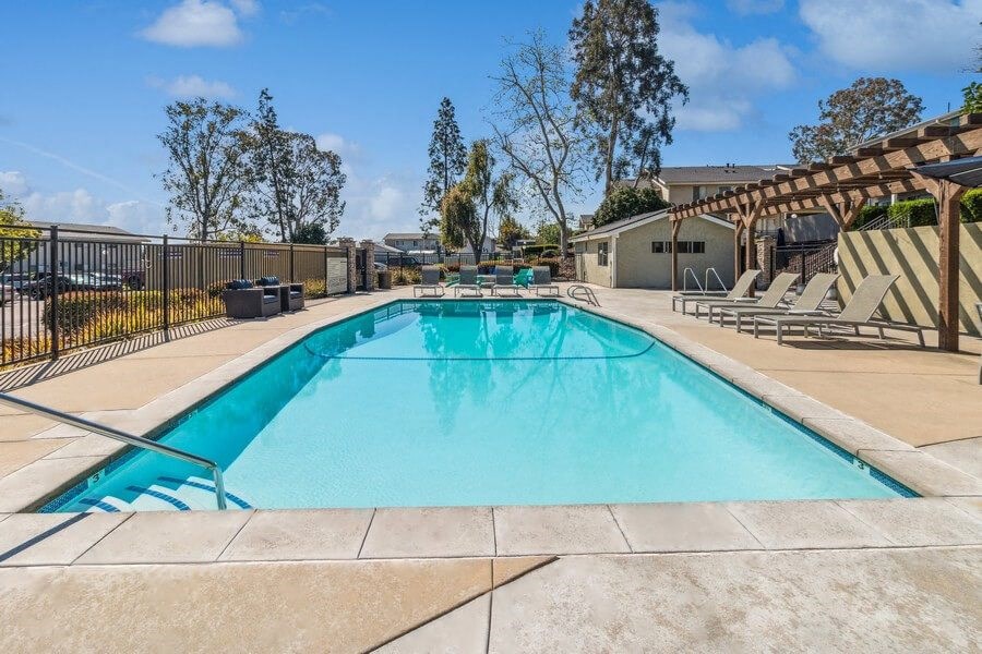 Community Pool & Pool Furniture at Forest Park Apartments in El Cajon, CA.