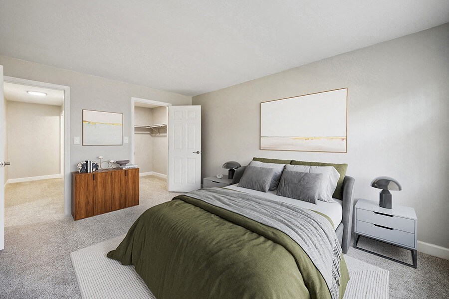 Model Bedroom with Carpet and Walk In Closet at Middlesex Crossing Apartments in Billerica, MA.
