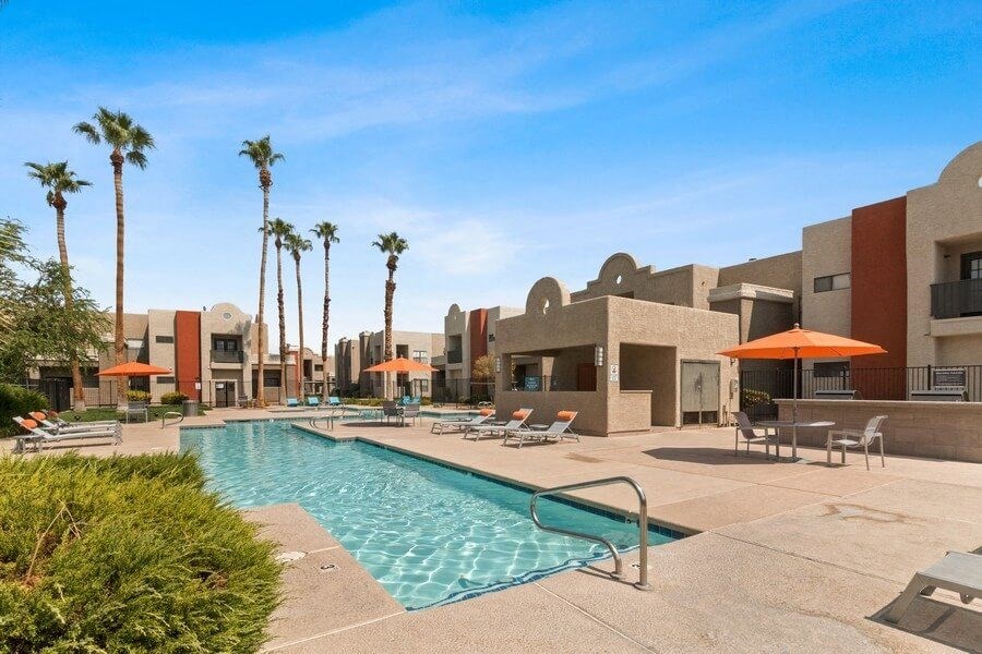 Swimming pool and lounge chairs with cabanas