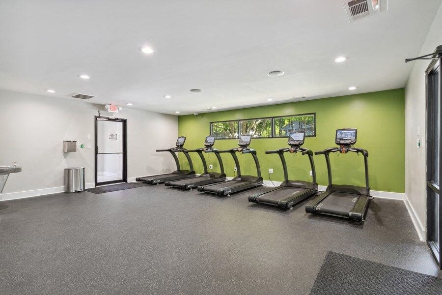 Community Fitness Center with Treadmills and Water Fountain at Dunwoody Village Apartments in Atlanta, GA.