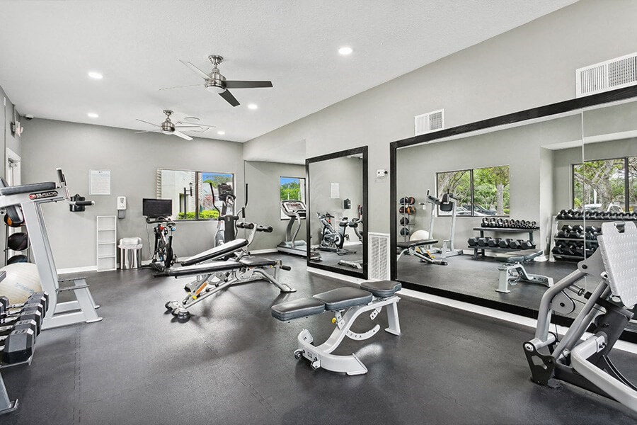 Community Fitness Center with Equipment at Huntington Place Apartments located in Sarasota, FL.