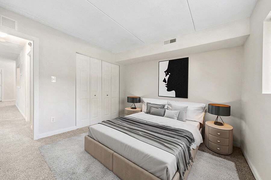 Model Bedroom with Carpet and Closet at Heights Marlborough Apartments in Boston, MA.