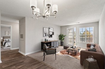 Model living area with door to patio and large window