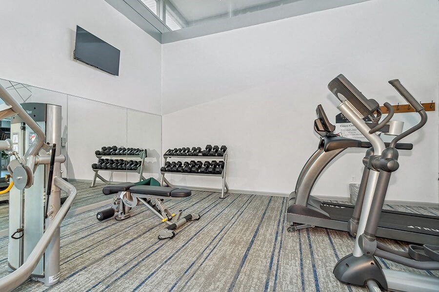 Fitness center interior with exercise equipment  at Stone Ends apartments in Stoughton, MA