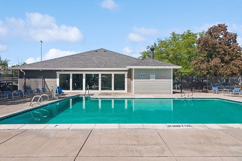 Community Swimming Pool with Pool Furniture at Overlook Apartments located in Salt Lake City, UT.