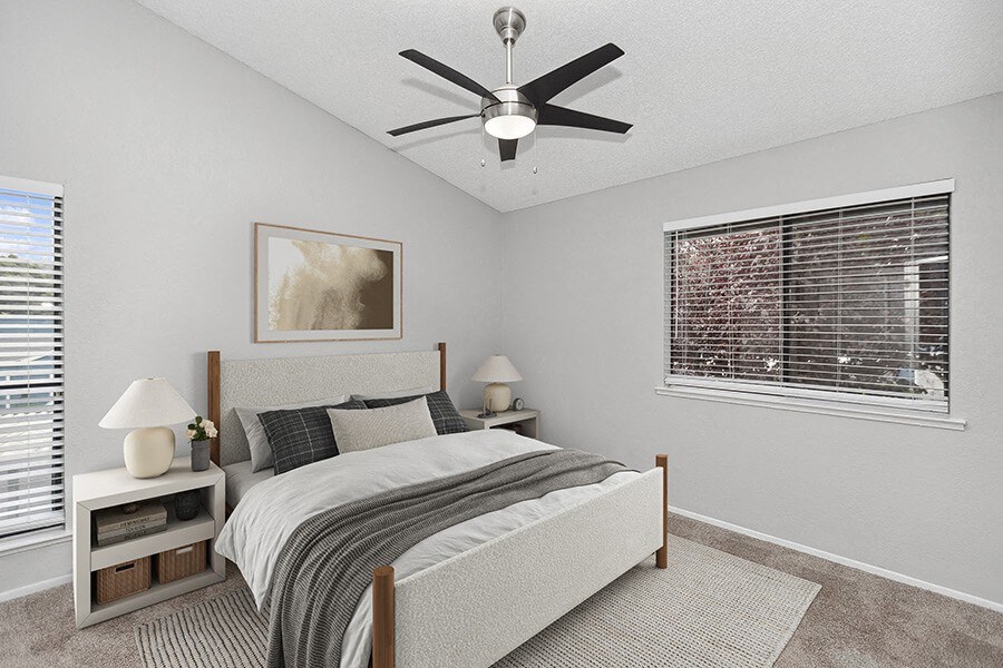 Model Bedroom with Carpet and Window Views at The Meritage Apartments in Vallejo, CA.