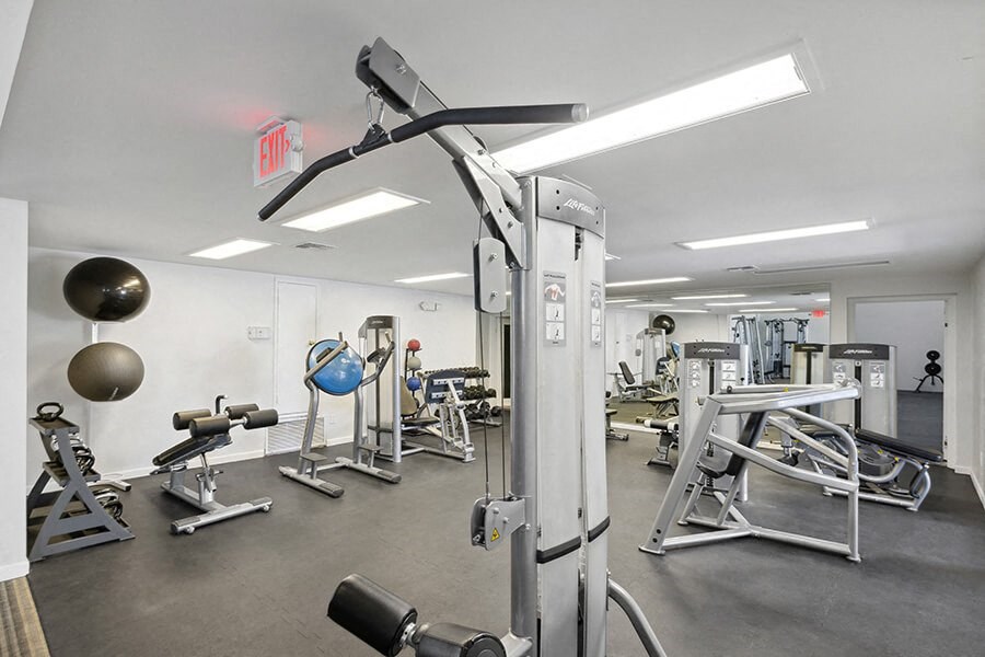 Community Fitness Center with Equipment at Hilands Apartments in Tucson, AZ.
