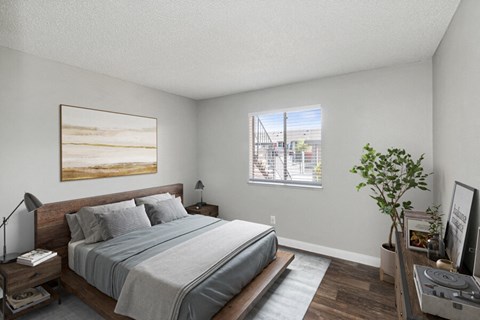 a bedroom with a large bed and a window