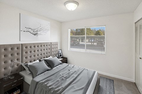 Model Bedroom with Carpet and Closet at Walnut Creek Apartments located in Walnut Creek, CA.