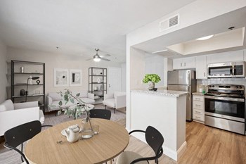 Model dining space and view of kitchen - Photo Gallery 3