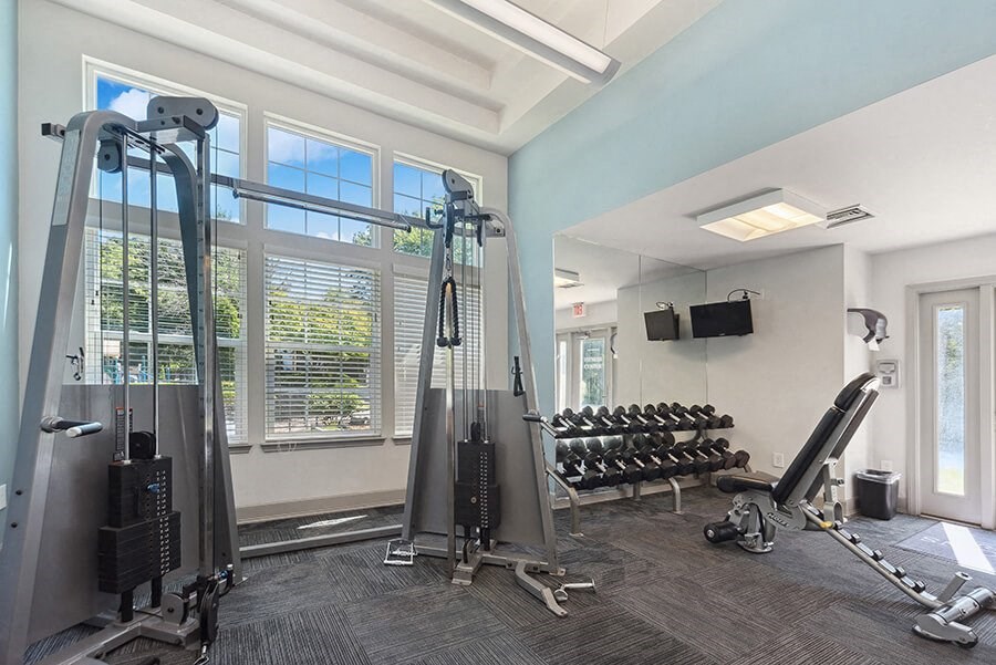 Community Fitness Center with Equipment and TV's at The Commons at Haynes Farm Apartments in Boston, MA.