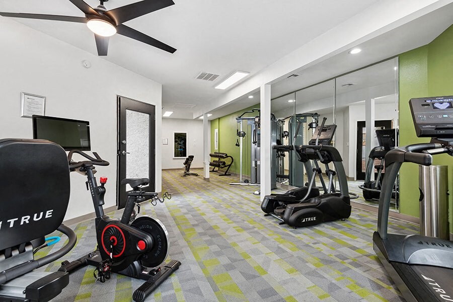 Community Fitness Center with Equipment at Crystal Creek Apartments in Phoenix, AZ.