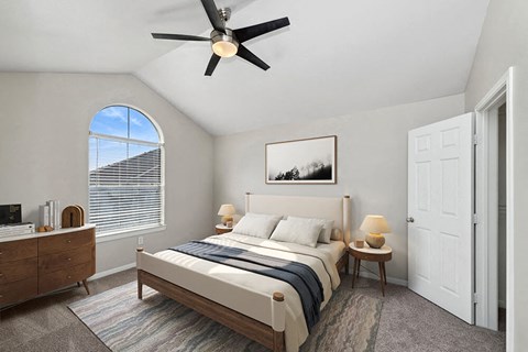 Model Bedroom with Carpet and Walk In Closet at Hidden Creek Apartments in Lewisville, TX.
