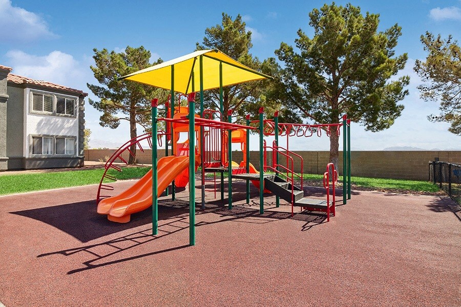 Community Playground with a Slide and Yellow Canopy at Loma Vista Apartments in Las Vegas, NV.