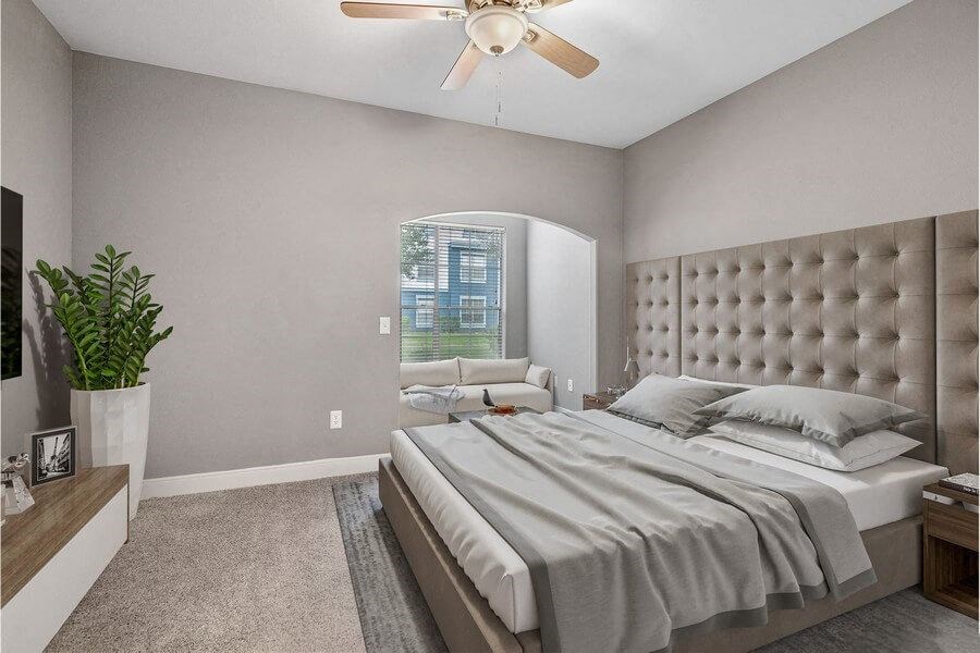 Model bedroom with lounge area with couch