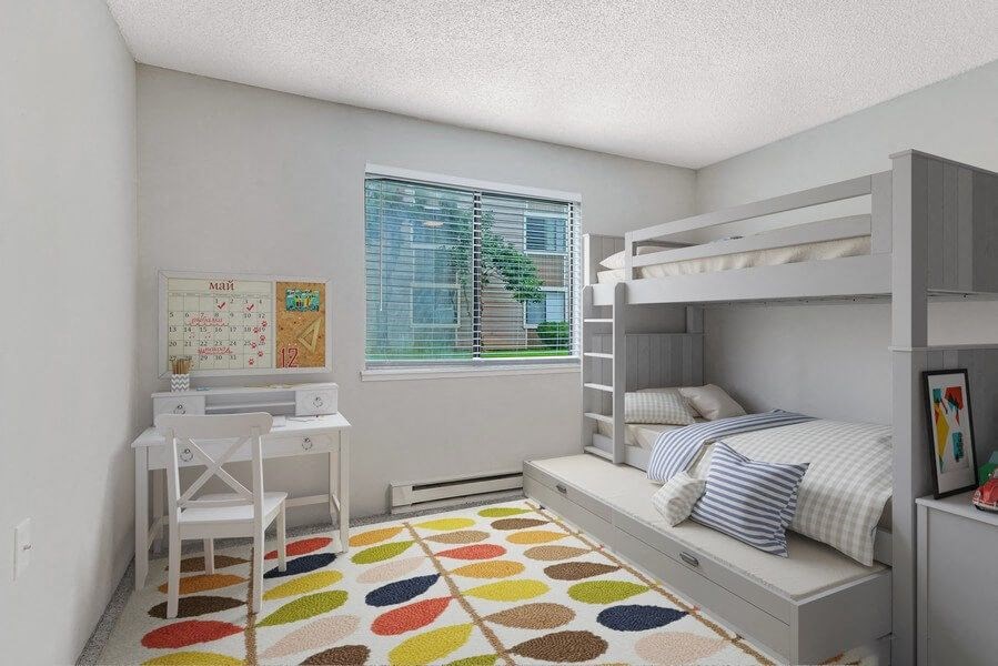 Model second bedroom with carpeting