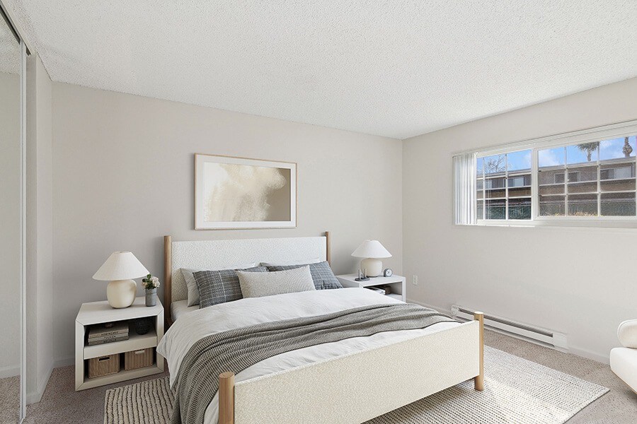 Model Bedroom with Carpet and Window View at Los Gatos Landing Apartments located in San Jose, CA.