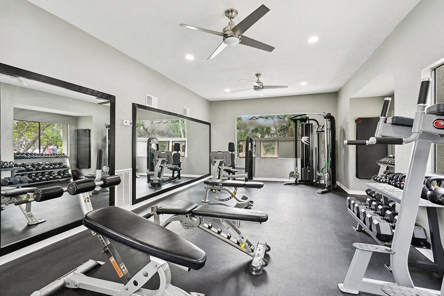 Community Fitness Center with Equipment at Huntington Place Apartments located in Sarasota, FL.