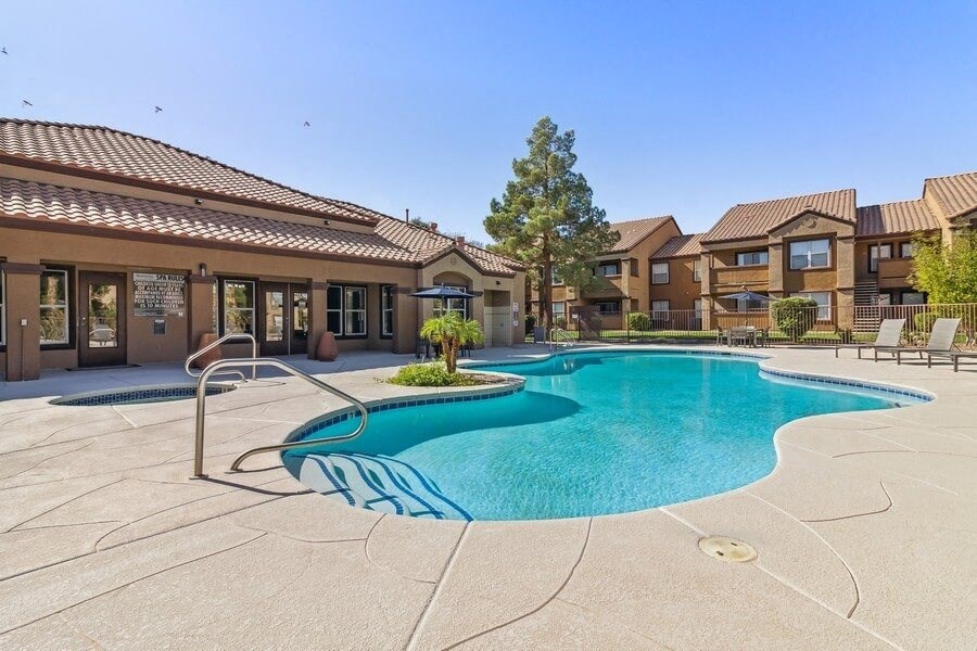 Pool with apartments in background