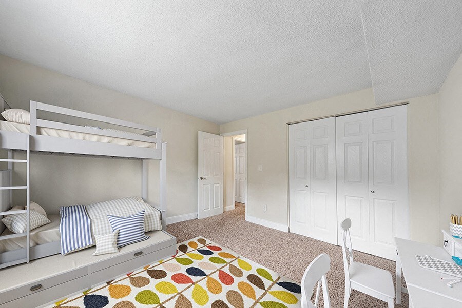Model Bedroom with Carpet and Closet at Meadows at Marlborough Apartments in Boston, MA.