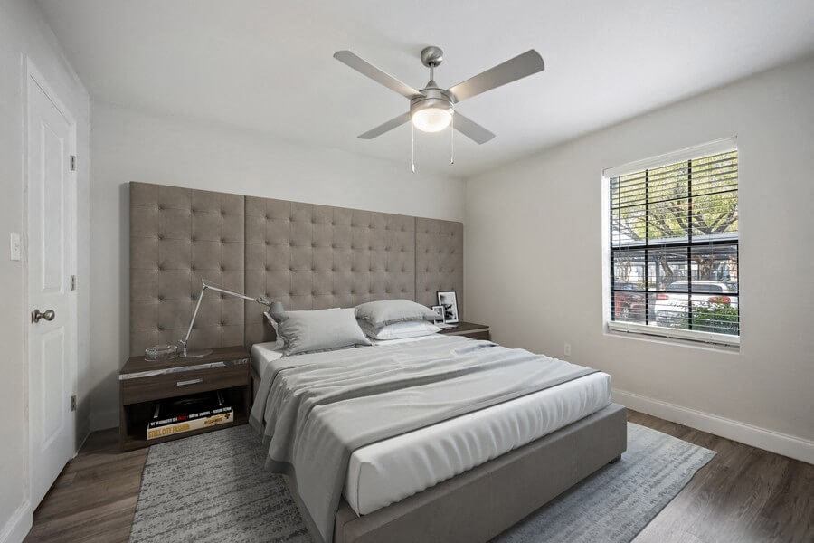 Model bedroom with window and fan