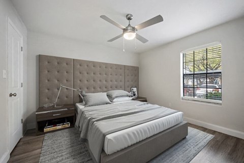 Model bedroom with window and fan
