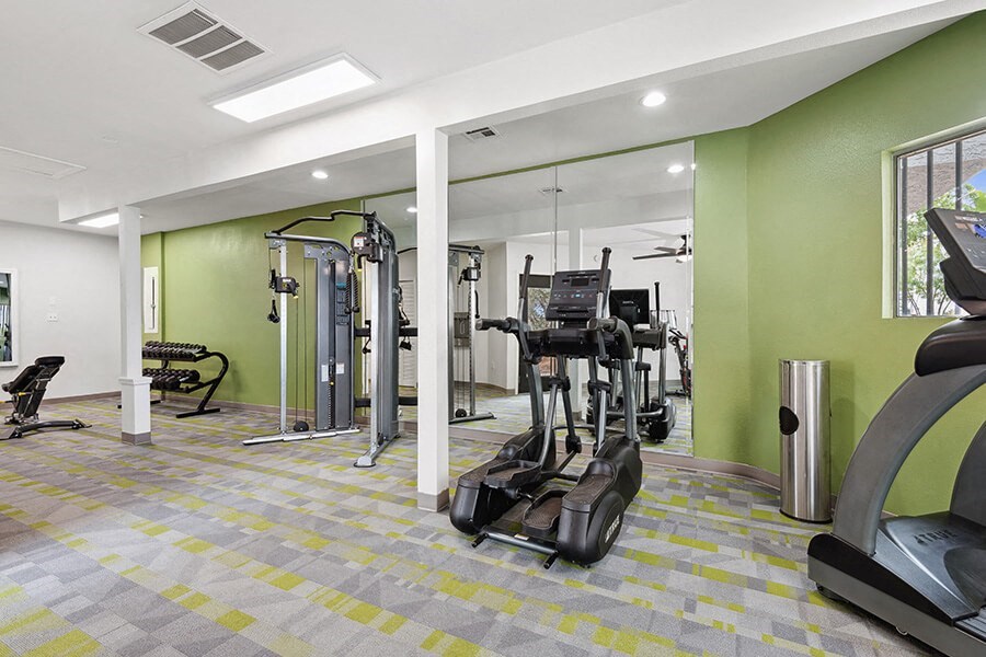 Community Fitness Center with Equipment at Crystal Creek Apartments in Phoenix, AZ.