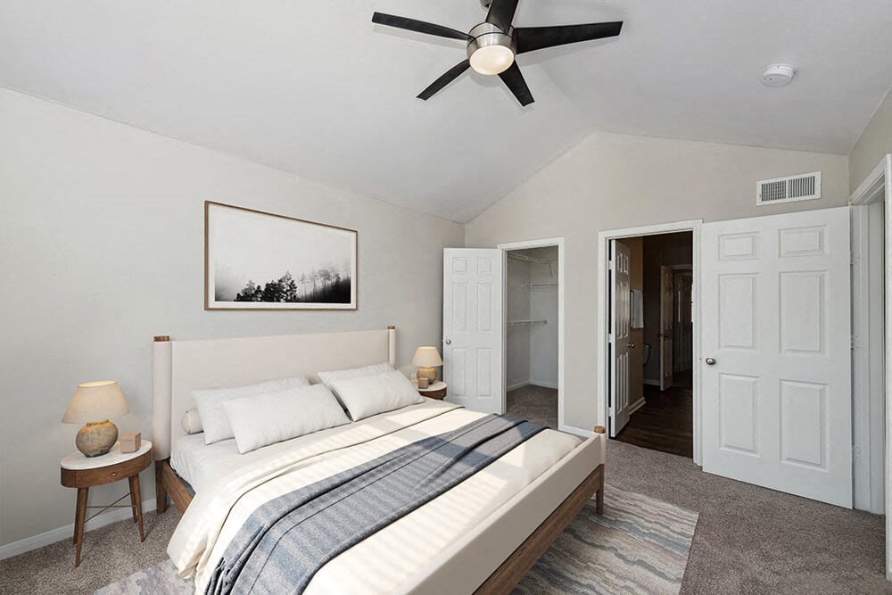 Model Bedroom with Carpet and Walk In Closet at Hidden Creek Apartments in Lewisville, TX.