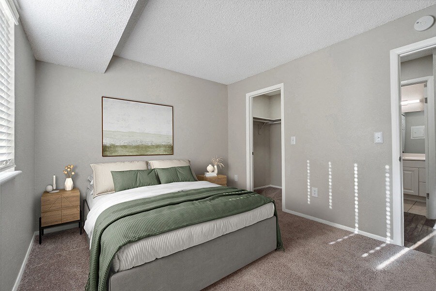Model Bedroom with Carpet and attached Bathroom Model Bedroom with Carpet and attached Bathroom at Liberty Creek Apartments in Aurora, CO.