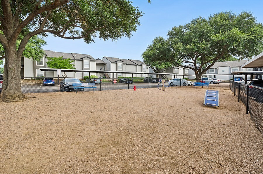 Community Dog Park with Agility Equipment at Cobblestone Apartments located in Arlington, TX.